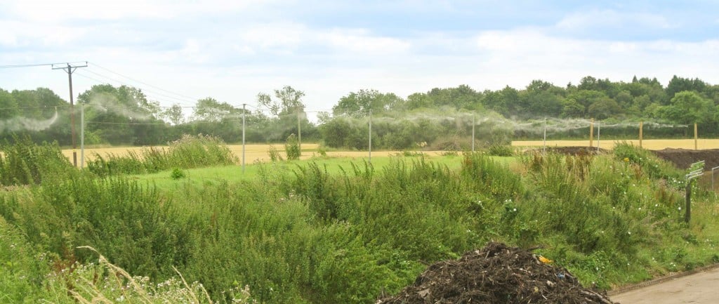 An odour suppression system giving perimeter coverage to a composting site