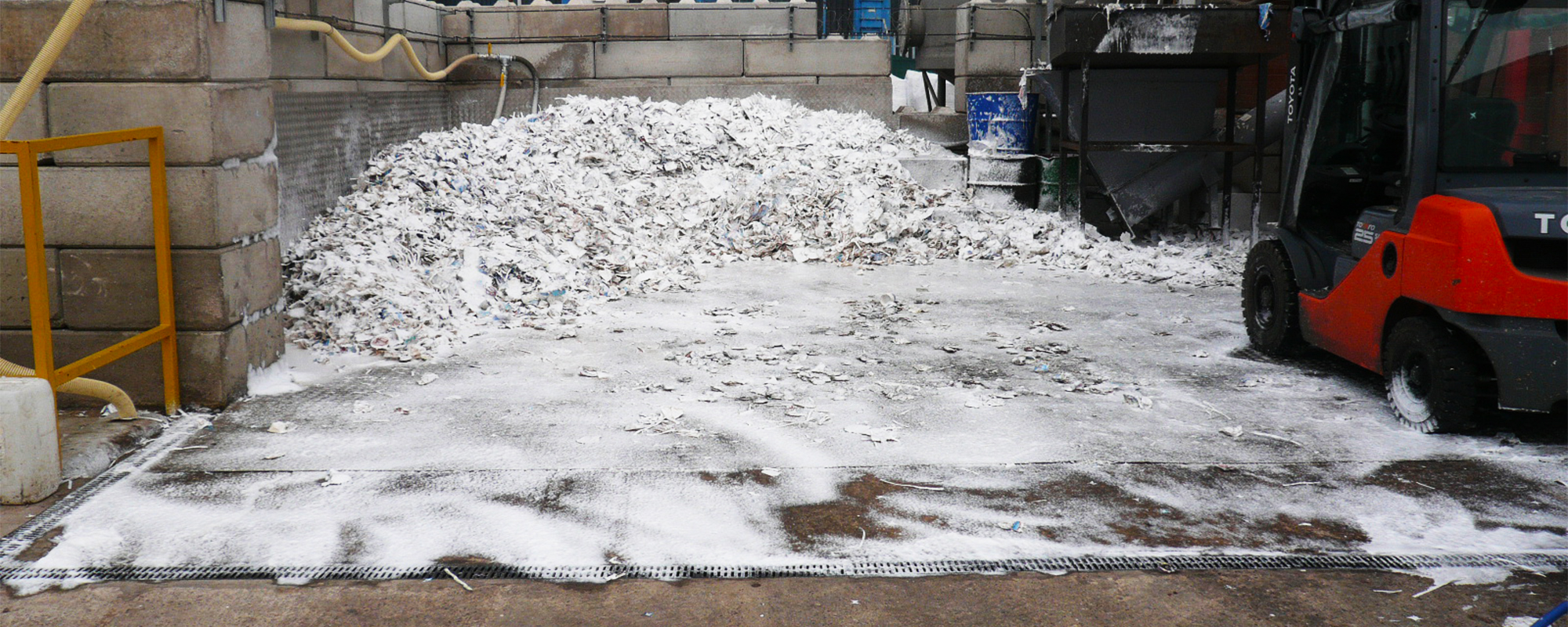 image-slider-foam-cover-rubbish-pile-bay-forklift